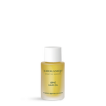 EPIC hair oil by Karmameju in a small frosted bottle with golden oil and a white cap