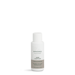 Small travel-size bottle of Karmameju GLORY conditioner with white cap and grey label